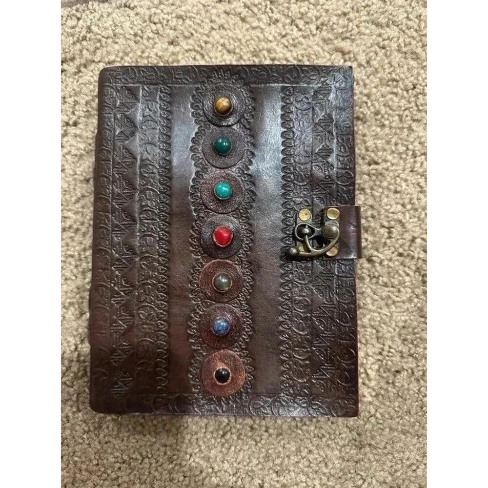 Handmade leather-bound notebook w/ latch detail